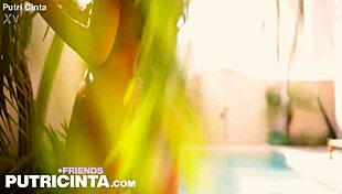 petite model putri cinta showing off her tanned big boobs