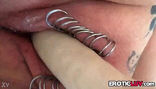 horny babe toys pierced pussy