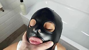 Pervert bitch sucks cock in bathtub with leather slave mask