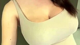 My stepmom flaunts her elastic ass and huge milky tits while I watch in awe. She teases with every move.