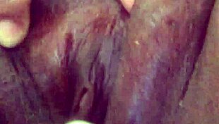 Ebony Squirts Passionately on Sofa