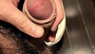 He asks, 'Want a quick handjob in the mall bathroom?' as he jerks his small cock.