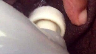 Ebony Squirts Passionately on Sofa