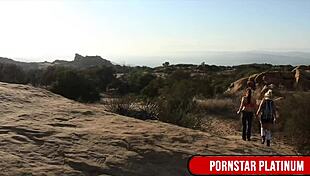 Samantha Rone tends to Mindi Mink's bushy pussy outdoors