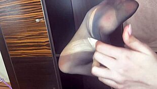 Closeup Foot In Black Stockings Plays With Anal Beads