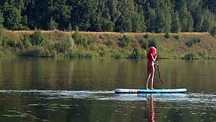 Tall skinny girl flashes her small tits in pink micro bikini at the beach