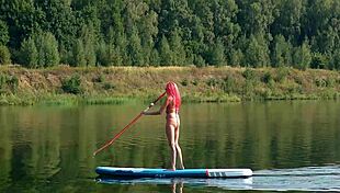 Tall skinny girl flashes her small tits in pink micro bikini at the beach