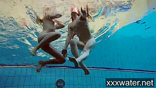 Milana And Katrin Strip Each Other Underwater In Pool
