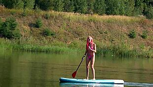 Tall skinny girl flashes her small tits in pink micro bikini at the beach