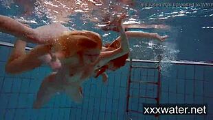 Milana And Katrin Strip Each Other Underwater In Pool