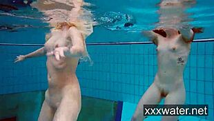 Milana And Katrin Strip Each Other Underwater In Pool