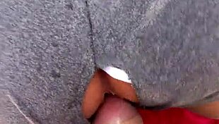 Intimate scene with sex toy outdoors.