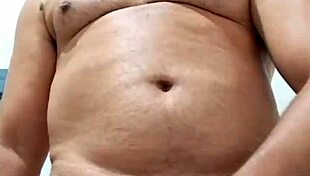 Brazilian bear Yuri Gaucho gives amateur handjob to huge black cock with big cumload