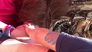 Intimate scene with sex toy outdoors.