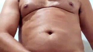 Brazilian bear Yuri Gaucho gives amateur handjob to huge black cock with big cumload