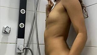 Cute teen masturbates in horny shower