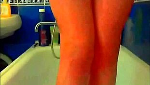 tattooed model plays with glass dildo in webcam solo masturbation