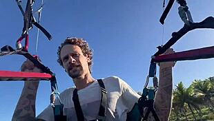 Brazilian babe flashes tits and ass naked, then gives blowjob to big cock in mid-air paragliding accident with unexpected fetish ending.