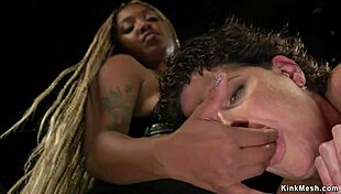 Ebony babe dominates tied cougar