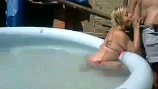 Watch This Horny Slut Get Creampied by the Pool in Public Webcam Action!