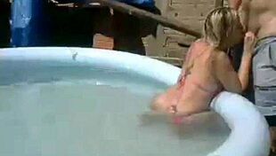 Watch This Horny Slut Get Creampied by the Pool in Public Webcam Action!
