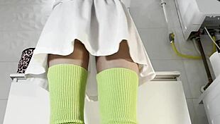 Hot Brunette College Girl With Mini Tennis Skirt And Over Knee Socks In Bathroom Shows Panties Under Short Skirt And Goes Also No Panties