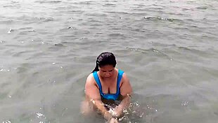 Oh wow, this chubby Latina with that massive ass on the beach, she's curvy and tattooed, making me so hot...