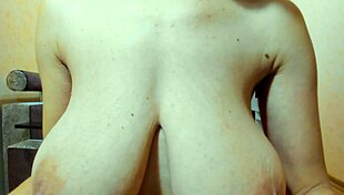 Hot brunette plays tits in bra then walks naked