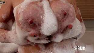 Horny Sara Jay finger fucks her big tits cougar pussy in bubble bath