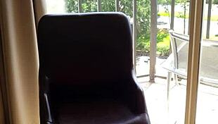 In a hotel room, she masturbates with a dildo and squirts everywhere.