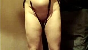 watch this slave girl masturbate in leather harness outdoors