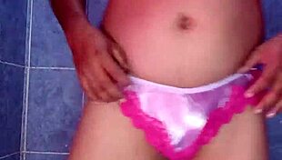 Mexican model dances seductively in satin lingerie and pantyhose