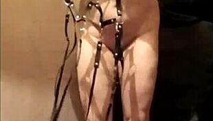 watch this slave girl masturbate in leather harness outdoors