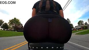 brunette milf shows big ass on motorcycle