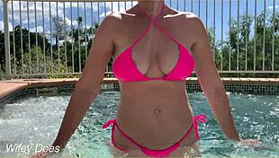 hey, check this out - my wife flashing her big tits right in the hotel pool, totally daring!