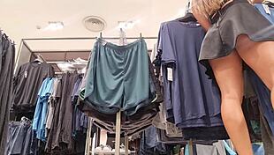 the super hot blonde was in the fitting room of the shopping mall, and she was trying on clothes