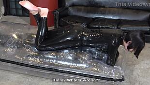 Mistress Yuen Interacts with Bound Man in Fetish Session