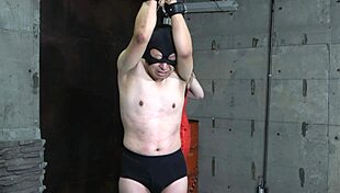 Japanese mistress whips slave's cock and balls with hot wax