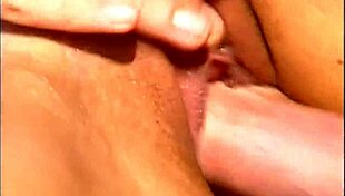 a mature man fucks an exotic babe in a cap and sunglasses on the seaside stones