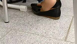 Check out this shoeplay with tan nylons and flats dipping.