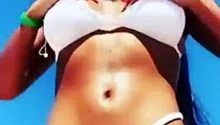 Enjoying hot vacations while showcasing big boobs and sexy body