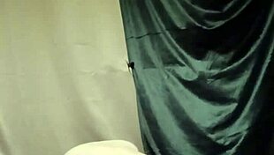 On August 5th, the female slave engages in a self-session of degradation, bound by a belt for urine play, enduring humiliation and spanking as a submissive slut.