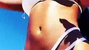 Enjoying hot vacations while showcasing big boobs and sexy body