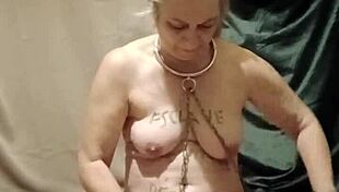 On August 5th, the female slave engages in a self-session of degradation, bound by a belt for urine play, enduring humiliation and spanking as a submissive slut.