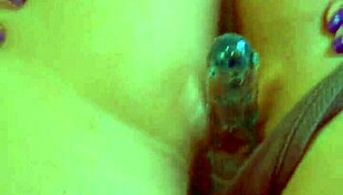 Desi beauty uses glass dildo for close-up masturbation, reaching orgasm with her shaved pussy.