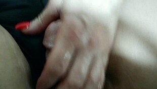 she gives a hot oiled handjob while rubbing her pussy, leading to a monster cock cumshot