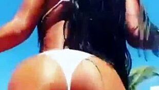 Enjoying hot vacations while showcasing big boobs and sexy body