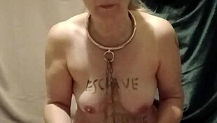 On August 5th, the female slave engages in a self-session of degradation, bound by a belt for urine play, enduring humiliation and spanking as a submissive slut.