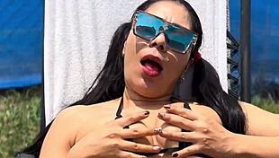 Horny slut masturbates outdoors in public pool, exposing pussy and tits, craving cock and cum