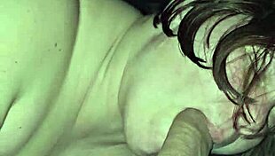 Milf rides foot while sucking huge cock, teasing the viewer with her actions